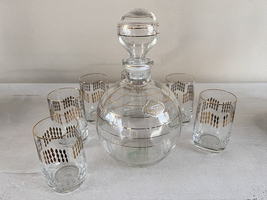 Karafje met 6 glaasjes glas helder/goud