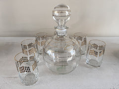 Karafje met 6 glaasjes glas helder/goud