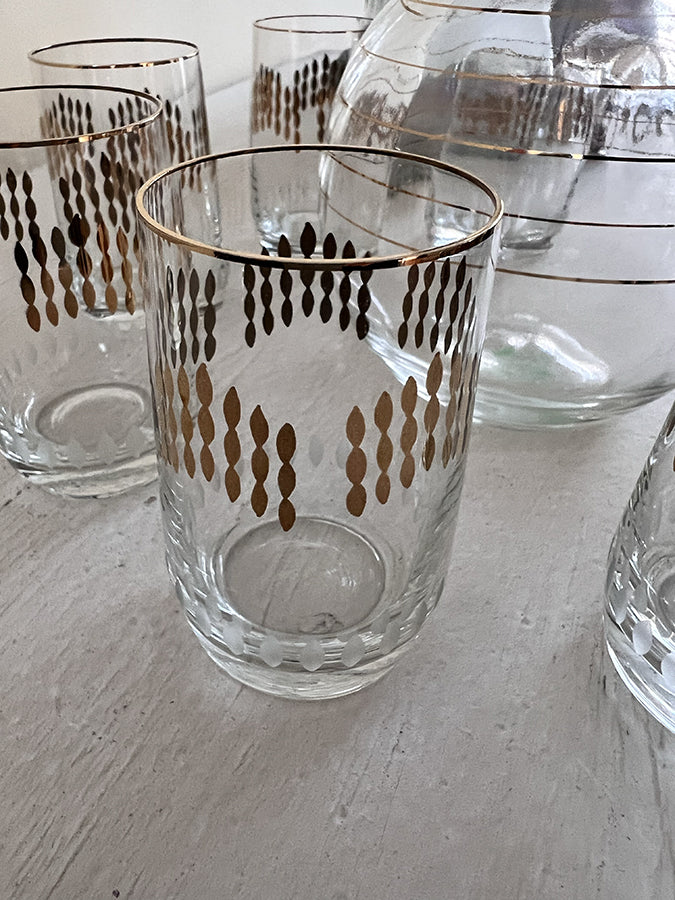 Karafje met 6 glaasjes glas helder/goud