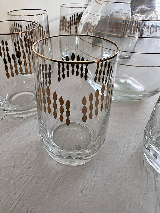 Karafje met 6 glaasjes glas helder/goud